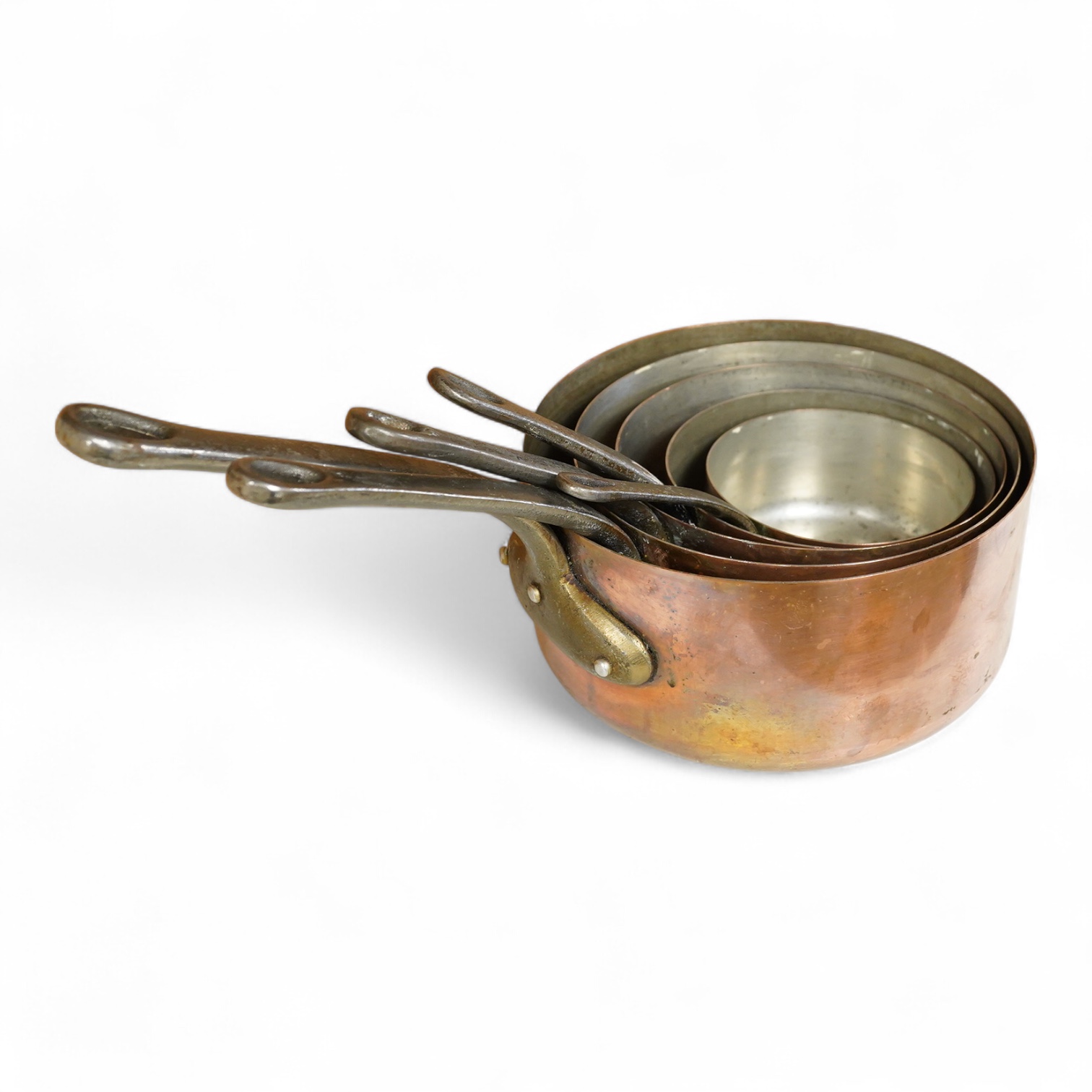 A graduated set five copper saucepans, signed Faucogney, largest 33cm wide